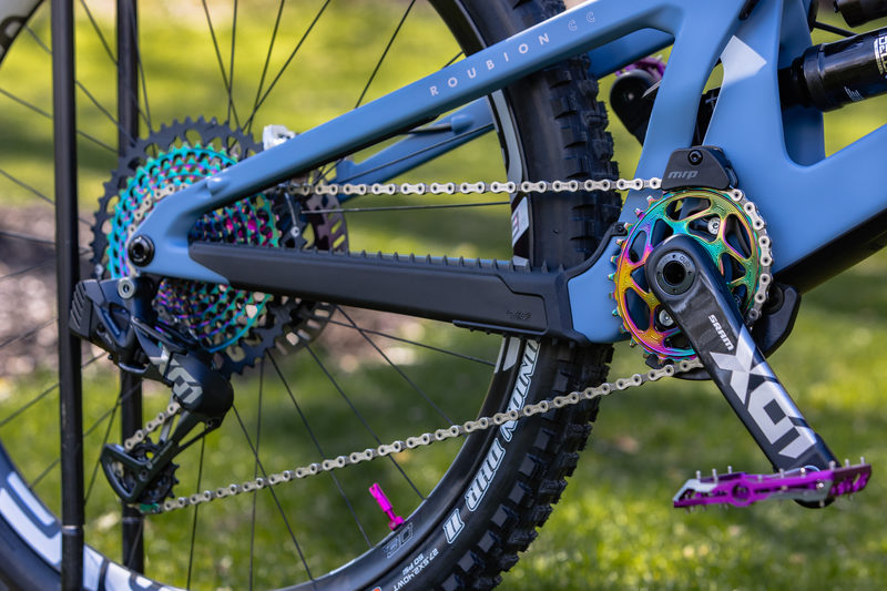 Close-up of a mountain bike's colorful drivetrain and chain