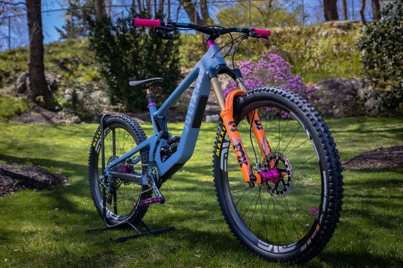 Juliana mountain bike posed on a stand among blooming azaleas